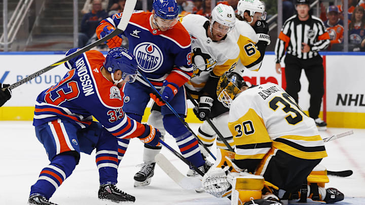 Edmonton Oilers forward Victor Arvidsson (33) jams at a loose puck in front of Pittsburgh Penguins goaltender