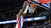 Dec 28, 2024; Denver, Colorado, USA; Detroit Pistons forward Ronald Holland II (00) dunks the ball in the second half against the Denver Nuggets at Ball Arena. Mandatory Credit: Ron Chenoy-Imagn Images