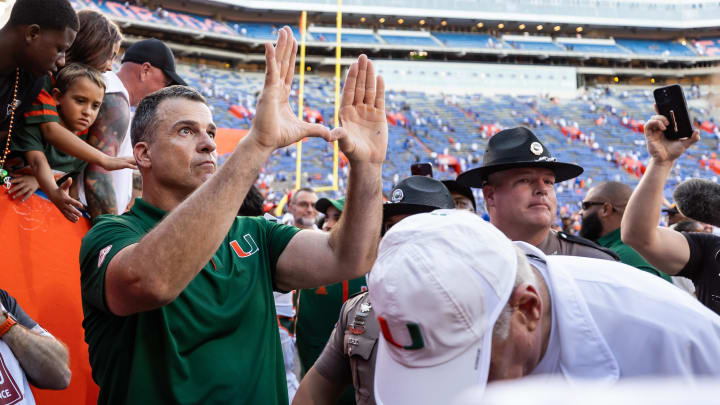 Aug 31, 2024; Gainesville, Florida, USA; Miami Hurricanes head coach Mario Cristobal gestures after a game against the Florida Gators at Ben Hill Griffin Stadium. Mandatory Credit: Matt Pendleton-USA TODAY Sports