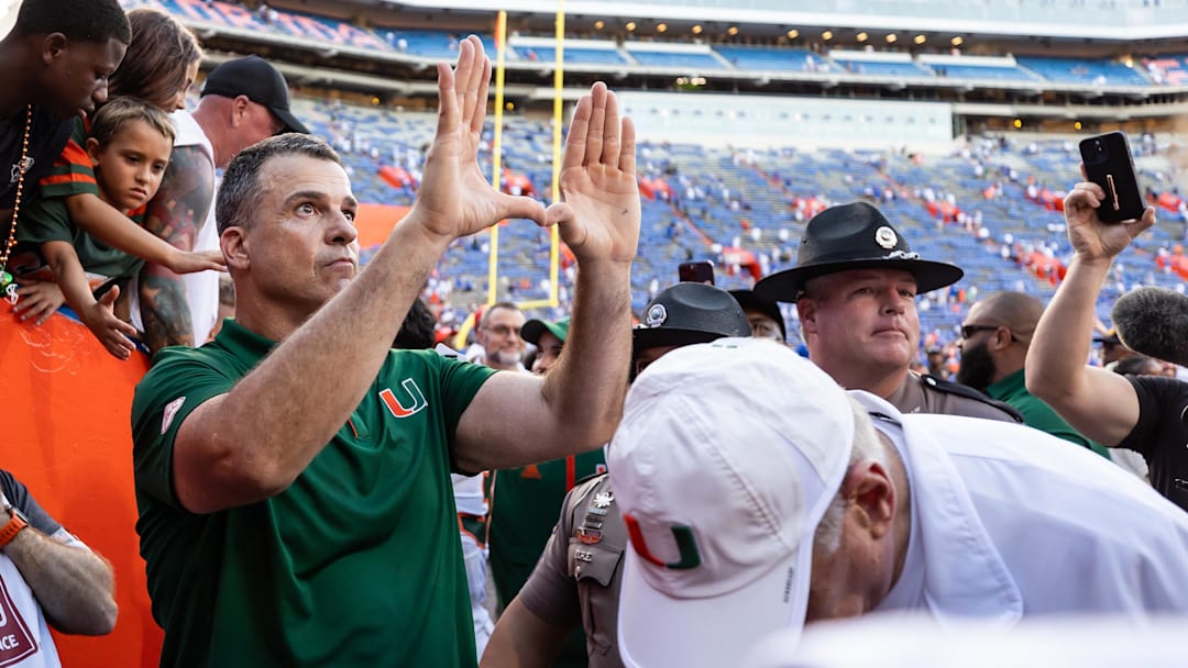 Aug 31, 2024; Gainesville, Florida, USA; Miami Hurricanes head coach Mario Cristobal gestures after a game against the Florida Gators at Ben Hill Griffin Stadium. Mandatory Credit: Matt Pendleton-Imagn Images