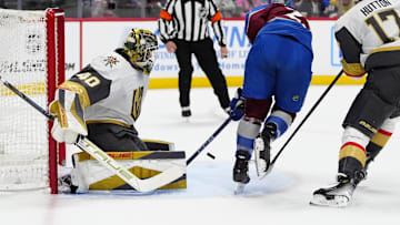 Apr 8, 2025; Denver, Colorado, USA; Colorado Avalanche right wing Logan O'Connor (25) shoots the puck at Vegas Golden Knights goaltender Akira Schmid (40) in the second period at Ball Arena. Mandatory Credit: Ron Chenoy-Imagn Images