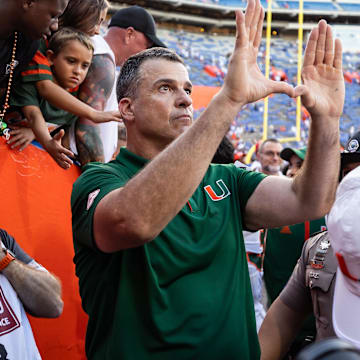 Aug 31, 2024; Gainesville, Florida, USA; Miami Hurricanes head coach Mario Cristobal gestures after a game against the Florida Gators at Ben Hill Griffin Stadium. Mandatory Credit: Matt Pendleton-Imagn Images