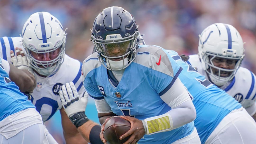 Tennessee Titans quarterback Cam Ward (1) maneuvers against the Indianapolis Colts during the first quarter at Nissan Stadium in Nashville, Tenn., Sunday, Sept. 14, 2025.