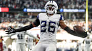 Dallas Cowboys CB Daron Bland carries the ball after an interception for a touchdown against the Washington Commanders.