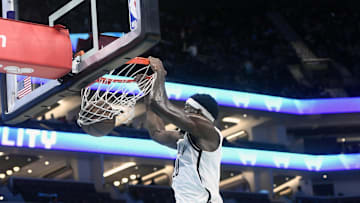 Oct 22, 2025; Charlotte, North Carolina, USA; Brooklyn Nets center Day'Ron Sharpe (20) dunks during the first half against the Charlotte Hornets at the Spectrum Center. Mandatory Credit: Sam Sharpe-Imagn Images