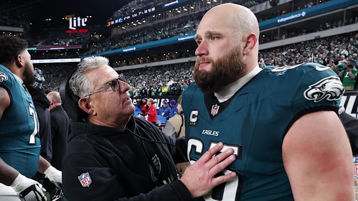 Jan 26, 2025; Philadelphia, PA, USA; Philadelphia Eagles assistant coach Jeff Stoutland (L) and offensive tackle Lane Johnson (65) in the final minute of a victory in the NFC Championship game against the Washington Commanders at Lincoln Financial Field. Mandatory Credit: Bill Streicher-Imagn Images