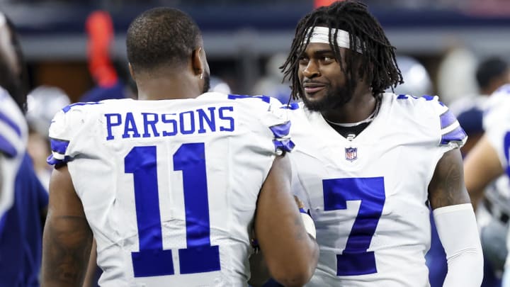 Sep 27, 2021; Arlington, Texas, USA;  Dallas Cowboys linebacker Micah Parsons (11) and cornerback Trevon Diggs (7) laugh during the game against the Philadelphia Eagles at AT&T Stadium. 