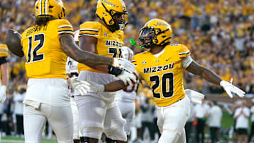 Three Missouri Tigers offensive players celebrate after a touchdown, in a game versus the South Carolina Gamecocks this season.