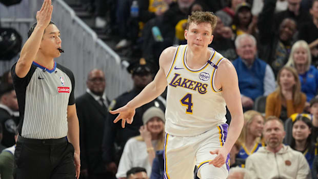 Los Angeles Lakers guard Dalton Knecht (4) gestures after making a three point basket against the Golden State Warriors