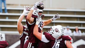 Missouri State Bears tight end Lance Mason (85) (center) is hoisted by teammates after scoring the game winning touchdown on the Youngstown State Penguins at Plaster Stadium on Saturday, Sept. 28, 2024.