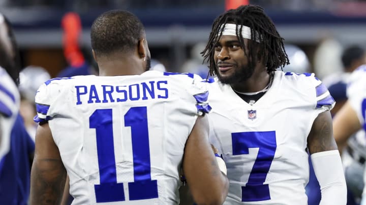 Sep 27, 2021; Arlington, Texas, USA;  Dallas Cowboys linebacker Micah Parsons (11) and cornerback Trevon Diggs (7) laugh during the game against the Philadelphia Eagles at AT&T Stadium. 