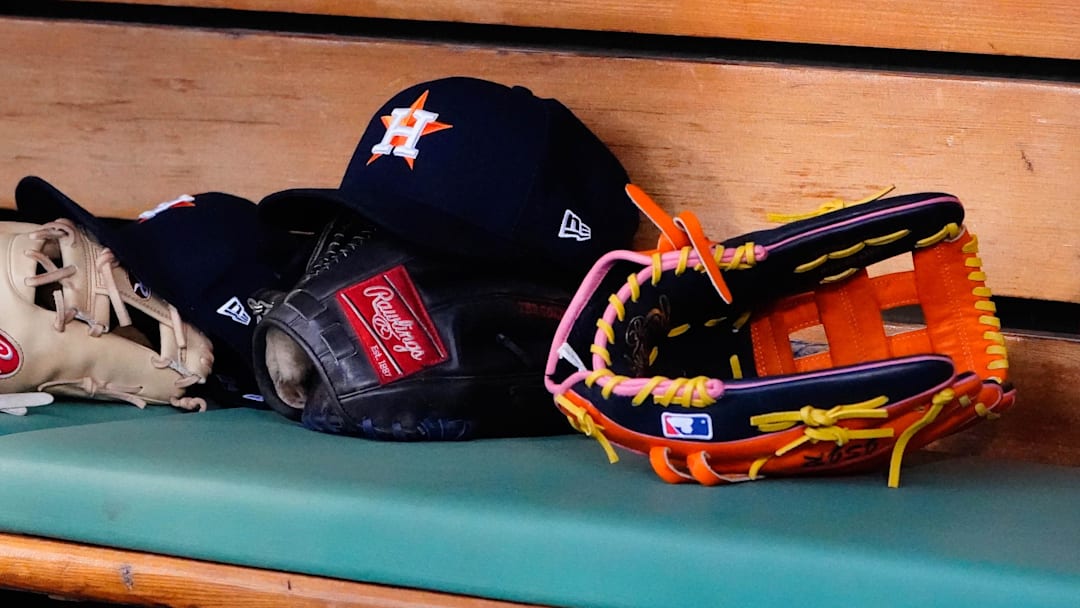 May 16, 2022; Boston, Massachusetts, USA;  A general view of gloves and Houston Astros hats prior to the game against the Boston Red Sox at Fenway Park.