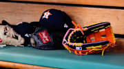 May 16, 2022; Boston, Massachusetts, USA;  A general view of gloves and Houston Astros hats prior to the game against the Boston Red Sox at Fenway Park.