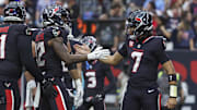 Dec 15, 2024; Houston, Texas, USA; Houston Texans wide receiver Nico Collins (12) celebrates with quarterback C.J. Stroud (7) after a touchdown reception during the second quarter against the Miami Dolphins at NRG Stadium. Mandatory Credit: Troy Taormina-Imagn Images
