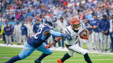 Cincinnati Bengals wide receiver Ja'Marr Chase (1) catches a pass over Tennessee Titans linebacker James Williams (52) during the second quarter at Nissan Stadium in Nashville, Tenn., Sunday, Dec. 15, 2024.