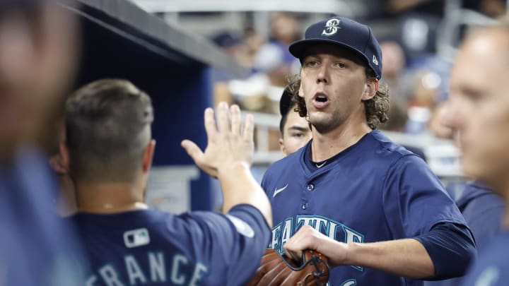 Seattle Mariners starting pitcher Logan Gilbert (36) celebrates in the dugout against the Miami Marlins in the seventh inning at loanDepot Park on June 22.