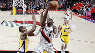 Jan 19, 2024; Portland, Oregon, USA; Portland Trail Blazers small forward Jerami Grant (9) drives to the basket against Indiana Pacers shooting guard Bennedict Mathurin (00) during the first half at Moda Center. Mandatory Credit: Soobum Im-Imagn Images