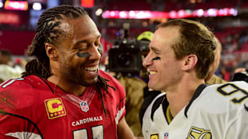 Dec 18, 2016; Glendale, AZ, USA; Arizona Cardinals wide receiver Larry Fitzgerald (11) and New Orleans Saints quarterback Drew Brees (9) talk after their game at University of Phoenix Stadium. Mandatory Credit: Matt Kartozian-Imagn Images