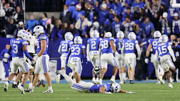 Oct 18, 2024; Provo, Utah, USA; The Brigham Young Cougars celebrate a win over the Oklahoma State Cowboys at LaVell Edwards Stadium. Mandatory Credit: Rob Gray-Imagn Images
