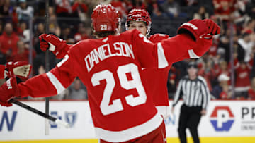 Nov 18, 2025; Detroit, Michigan, USA; Detroit Red Wings center Emmitt Finnie (58) celebrates a goal with center Nate Danielson (29) in the second period against the Seattle Kraken at Little Caesars Arena. Mandatory Credit: Rick Osentoski-Imagn Images