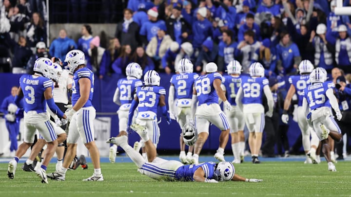 Oct 18, 2024; Provo, Utah, USA; The Brigham Young Cougars celebrate a win over the Oklahoma State Cowboys at LaVell Edwards Stadium. Mandatory Credit: Rob Gray-Imagn Images