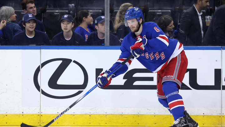 May 22, 2024; New York, New York, USA; New York Rangers defenseman Jacob Trouba (8) controls the puck against the Florida Panthers during the third period of game one of the Eastern Conference Final of the 2024 Stanley Cup Playoffs at Madison Square Garden. Mandatory Credit: Brad Penner-USA TODAY Sports