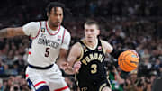 Connecticut Huskies guard Stephon Castle (5) guards Purdue Boilermakers guard Braden Smith (3) during the 2024 title game.