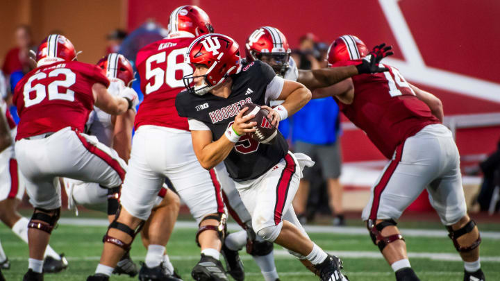 Indiana's Kurtis Rourke (9) scrambles during the Indiana football spring game at Memorial Stadium on Thursday, April 18, 2024.