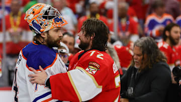 Jun 24, 2024; Sunrise, Florida, USA; Edmonton Oilers goaltender Stuart Skinner (74) and Florida Panthers goaltender Sergei Bobrovsky (72) talk after game seven of the 2024 Stanley Cup Final at Amerant Bank Arena. Mandatory Credit: Sam Navarro-Imagn Images