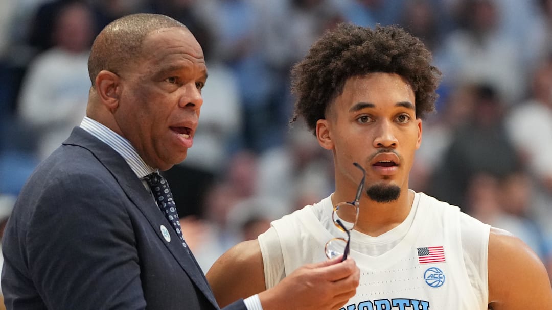 Nov 7, 2025; Chapel Hill, North Carolina, USA;  North Carolina Tar Heels head coach Hubert Davis with guard Seth Trimble (7) in the second half at Dean E. Smith Center. Mandatory Credit: Bob Donnan-Imagn Images