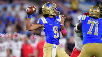 Aug 30, 2025;UCLA Bruins quarterback Nico Iamaleava (9) throws against the Utah Utes. Mandatory Credit: Gary A. Vasquez-Imagn Images