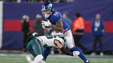 Jan 7, 2024; East Rutherford, New Jersey, USA; New York Giants tight end Darren Waller (12) is tackled by Philadelphia Eagles safety Tristin McCollum (36) during the second half at MetLife Stadium. Mandatory Credit: Vincent Carchietta-USA TODAY Sports