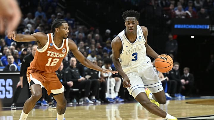 Mar 19, 2026; Portland, OR, USA; BYU Cougars forward AJ Dybantsa (3) drives against Texas Longhorns guard Tramon Mark (12) in the first half during a first round game of the men's 2026 NCAA Tournament at Moda Center. Mandatory Credit: Craig Strobeck-Imagn Images
