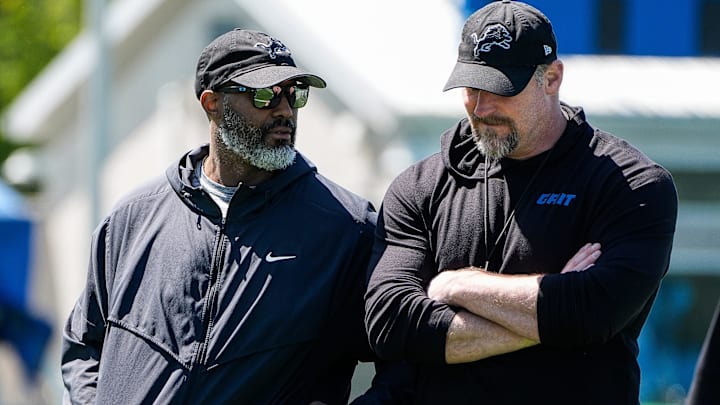 Detroit Lions general manager Brad Holmes, left, talks to head coach Dan Campbell as they walk off the field after practice during rookie mini camp at Meijer Performance Center in Allen Park on Friday, May 9, 2025.