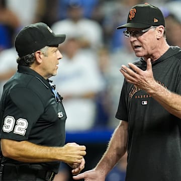 Sep 20, 2024; Kansas City, Missouri, USA; San Francisco Giants manager Bob Melvin (6) talks with umpire James Hoye (92) during the ninth inning against the Kansas City Royals at Kauffman Stadium.