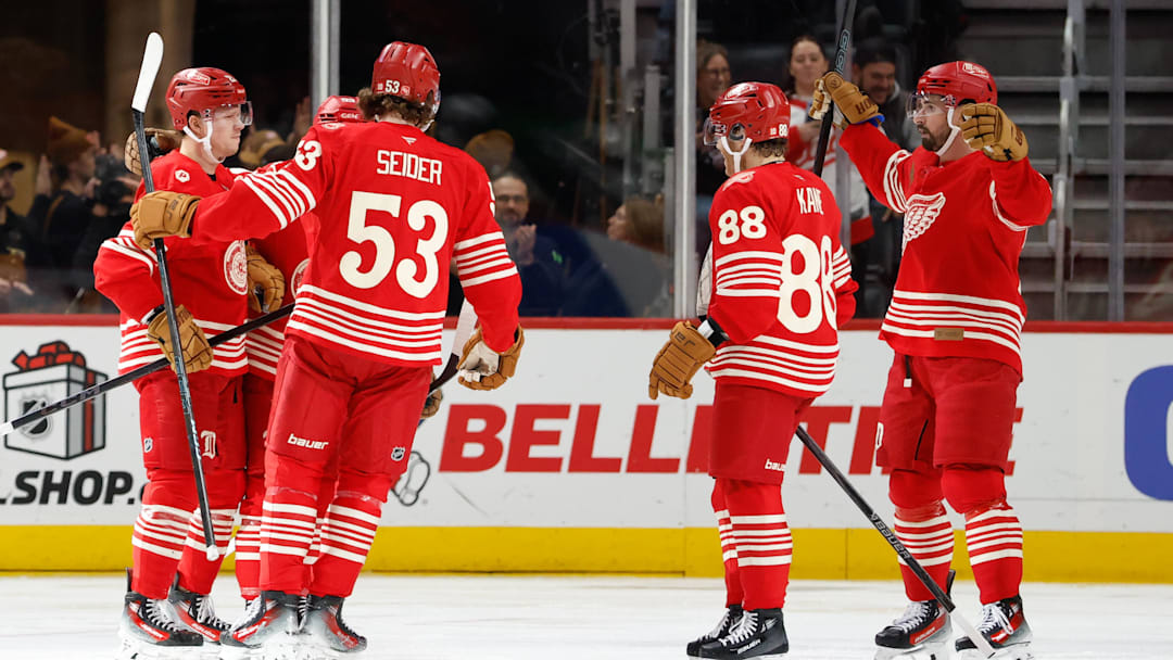Dec 2, 2025; Detroit, Michigan, USA;  Detroit Red Wings left wing Lucas Raymond (23) receives congratulations from teammates after scoring in the third period against the Boston Bruins at Little Caesars Arena. Mandatory Credit: Rick Osentoski-Imagn Images