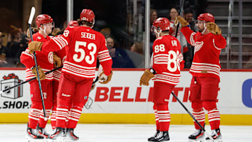 Dec 2, 2025; Detroit, Michigan, USA;  Detroit Red Wings left wing Lucas Raymond (23) receives congratulations from teammates after scoring in the third period against the Boston Bruins at Little Caesars Arena. Mandatory Credit: Rick Osentoski-Imagn Images