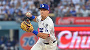 Los Angeles Dodgers second baseman Tommy Edman (25) throws to first for an out against Toronto Blue Jays shortstop Andres Gimenez (not pictured) in the third inning during game three of the 2025 MLB World Series at Dodger Stadium on Monday.