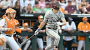 Jun 22, 2024; Omaha, NE, USA;  Texas A&M Aggies left fielder Caden Sorrell (13) drives in a run against the Tennessee Volunteers during the first inning at Charles Schwab Field Omaha. Mandatory Credit: Steven Branscombe-Imagn Images