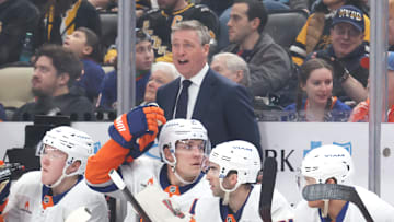 Mar 18, 2025; Pittsburgh, Pennsylvania, USA;  New York Islanders head coach Patrick Roy (rear) reacts on the bench against the Pittsburgh Penguins during the third period at PPG Paints Arena. Mandatory Credit: Charles LeClaire-Imagn Images