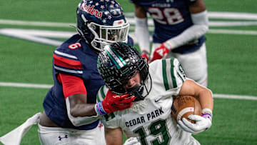 Denton Ryan sophomore linebacker Anthony Hill Jr. (6) grabs the face mask of Cedar Park senior wide receiver Jack Hestera (19) during the first half of a state championship high school football game on Friday, Jan. 15, 2021 at AT&T Stadium in Arlington, Texas.