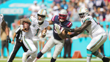 Oct 29, 2023; Miami Gardens, Florida, USA; Miami Dolphins quarterback Tua Tagovailoa (1) runs with the football against the New England Patriots during the second quarter at Hard Rock Stadium. Mandatory Credit: Sam Navarro-USA TODAY Sports