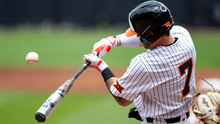 Oklahoma State utility Roc Riggio (7) hits a foul ball during a game in the NCAA Stillwater Regional between the Oklahoma State Cowboys (OSU) and the Dallas Baptist Patriots at O'Brate Stadium in Stillwater, Okla., on Saturday, June 3, 2023.
