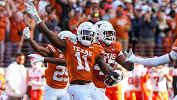 Texas Longhorns edge rusher Colin Simmons (11) celebrates an interception during the game against Clemson in the first round of the College Football Playoffs at Darrell K Royal-Texas Memorial Stadium on Saturday, Dec. 21, 2024.