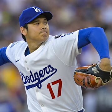 Los Angeles Dodgers designated hitter Shohei Ohtani (17) throws against the San Diego Padres during the first inning at Dodger Stadium.