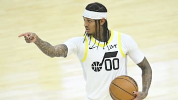 Dec 23, 2024; Cleveland, Ohio, USA; Utah Jazz guard Jordan Clarkson (00) reacts in the fourth quarter against the Cleveland Cavaliers at Rocket Mortgage FieldHouse. Mandatory Credit: David Richard-Imagn Images