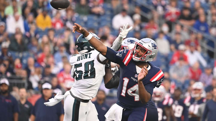 Aug 15, 2024; Foxborough, MA, USA; New England Patriots quarterback Jacoby Brissett (14) throws an interception during the first half against the Philadelphia Eagles at Gillette Stadium. Eric Canha-USA TODAY Sports