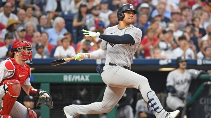 Jul 29, 2024; Philadelphia, Pennsylvania, USA;  New York Yankees outfielder Juan Soto (22) hits a two RBI double against the Philadelphia Phillies during the fifth inning at Citizens Bank Park.