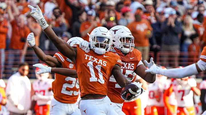 Texas Longhorns edge rusher Colin Simmons (11) celebrates an interception during the game against Clemson in the first round of the College Football Playoffs at Darrell K Royal-Texas Memorial Stadium on Saturday, Dec. 21, 2024.
