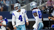 Prescott (4) celebrates with Lamb (88) after a touchdown during the first quarter against the New England Patriots. 